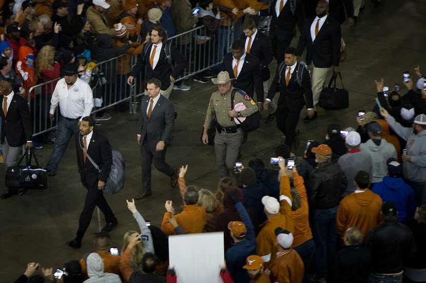Texas head coach Tom Herman leads his team on the spirit walk into the stadium before the...