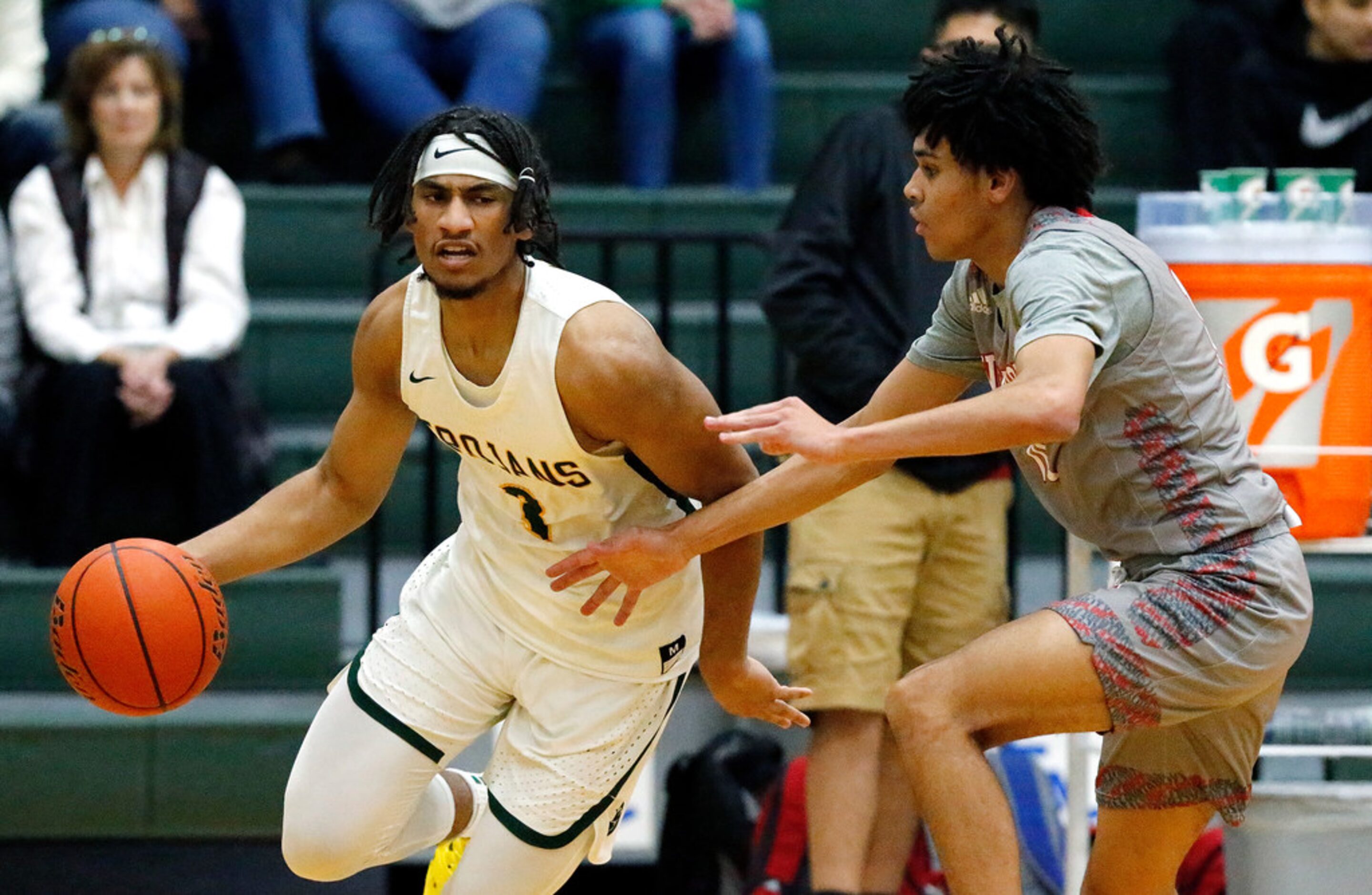 Newman Smith High School forward Jarren Cook (3) is defended by Woodrow Wilson High School...