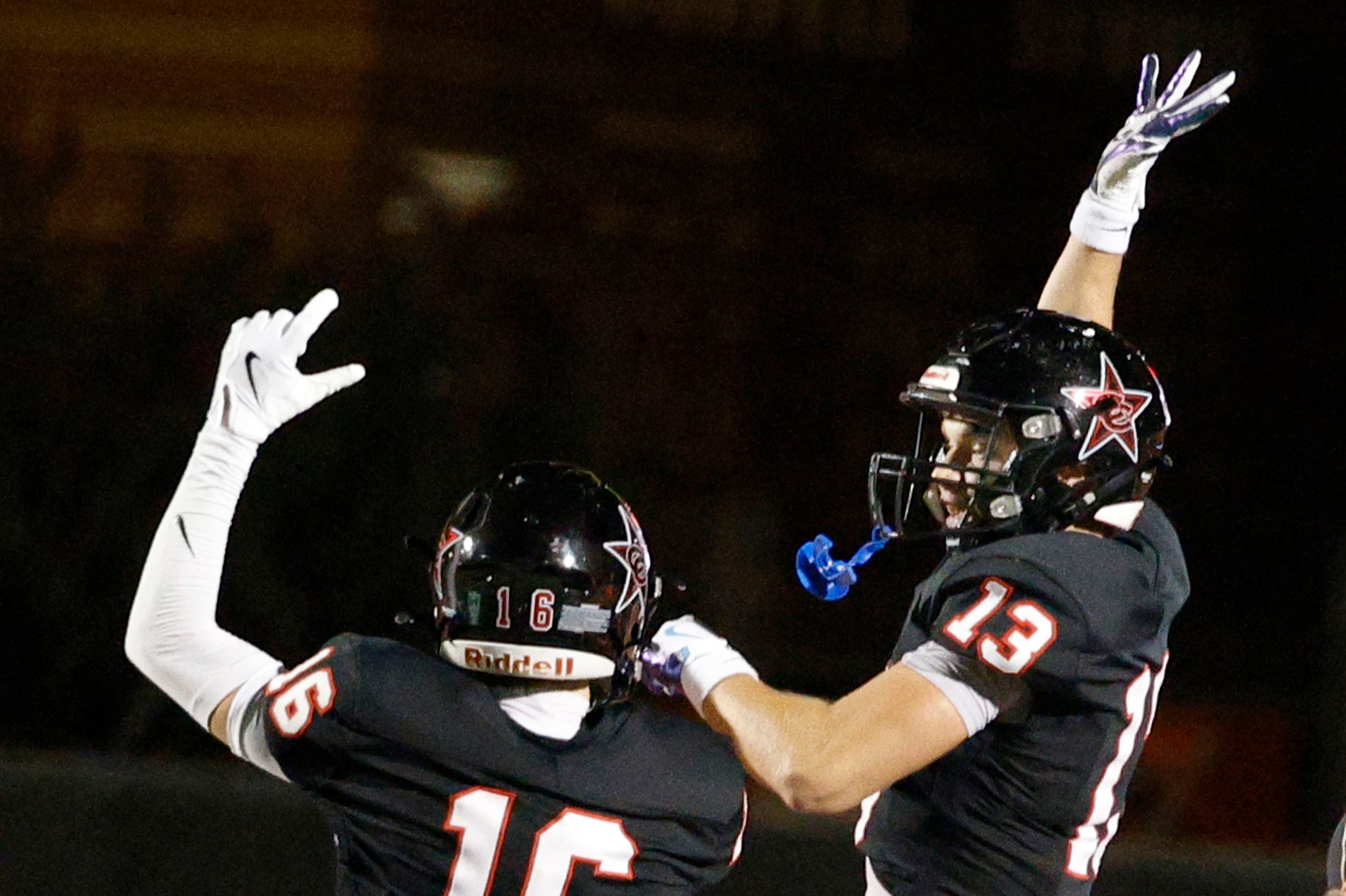 Coppell's Harry Hassmann (13) celebrate with his teammate Ethan Schuy (16) after scoring a...