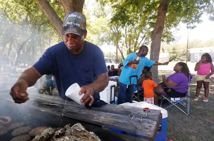 
Fred Hamilton worked the grill during the 40th Miller family reunion at Miller Family Park...