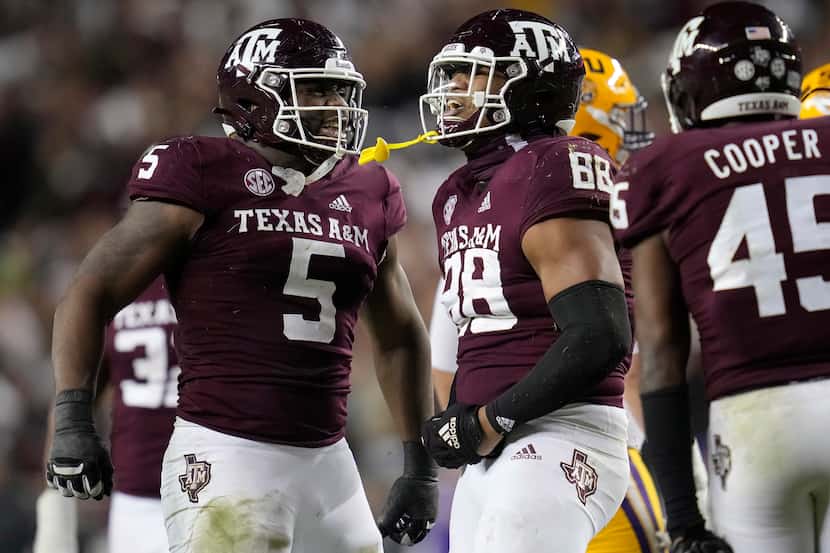 Texas A&M's Walter Nolen (88) and Shemar Turner (5) react after stopping LSU on a third-down...