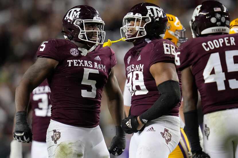 Texas A&M's Walter Nolen (88) and Shemar Turner (5) react after stopping LSU on a third-down...