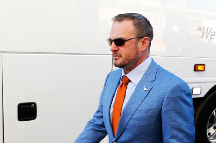Texas Longhorns head coach Tom Herman makes his way to the stadium before a game against...