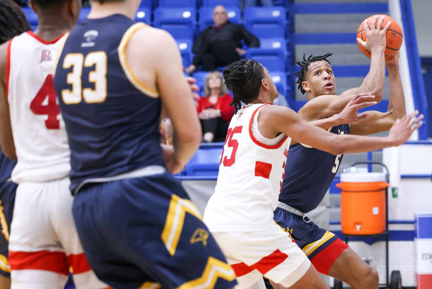 Prestonwood Christian Academy senior forward Donovan Lovelace (5) raises the ball away from...