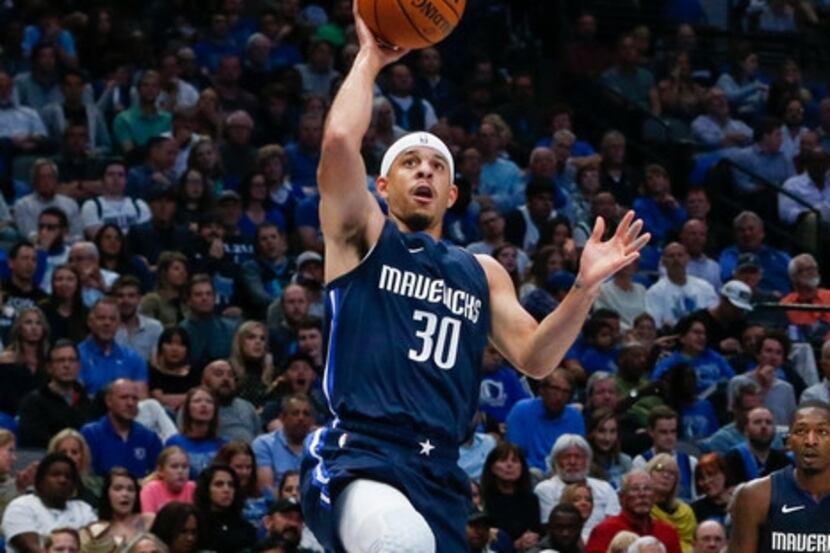 FILE - Mavericks guard Seth Curry (30) puts up a shot during the second quarter of a game...