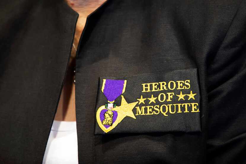 Jackie Frazier of the Mesquite Veterans Memorial Campaign sports a "Heroes of Mesquite"...