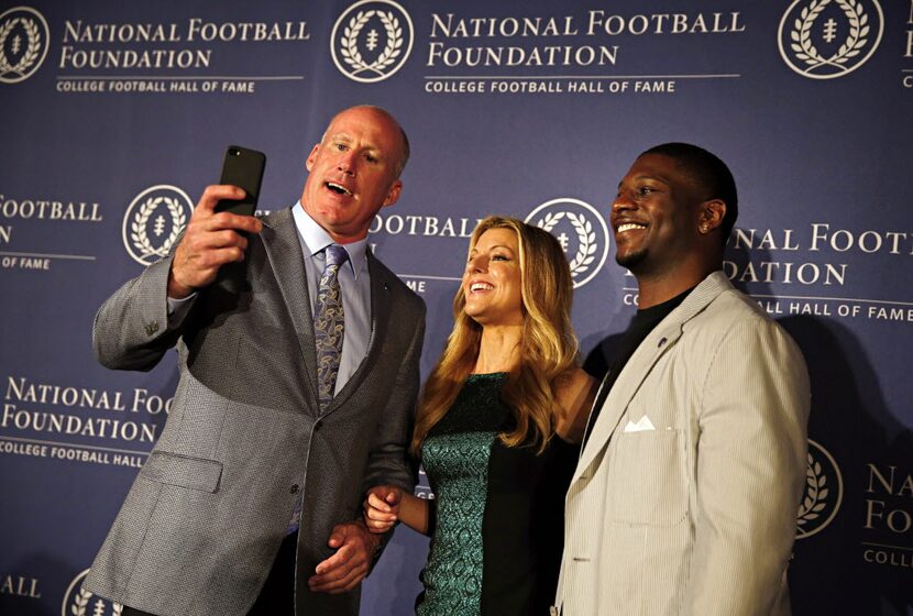 College Football Hall of Fame inductees Shane Conlan (left) and LaDainian Tomlinson (right)...