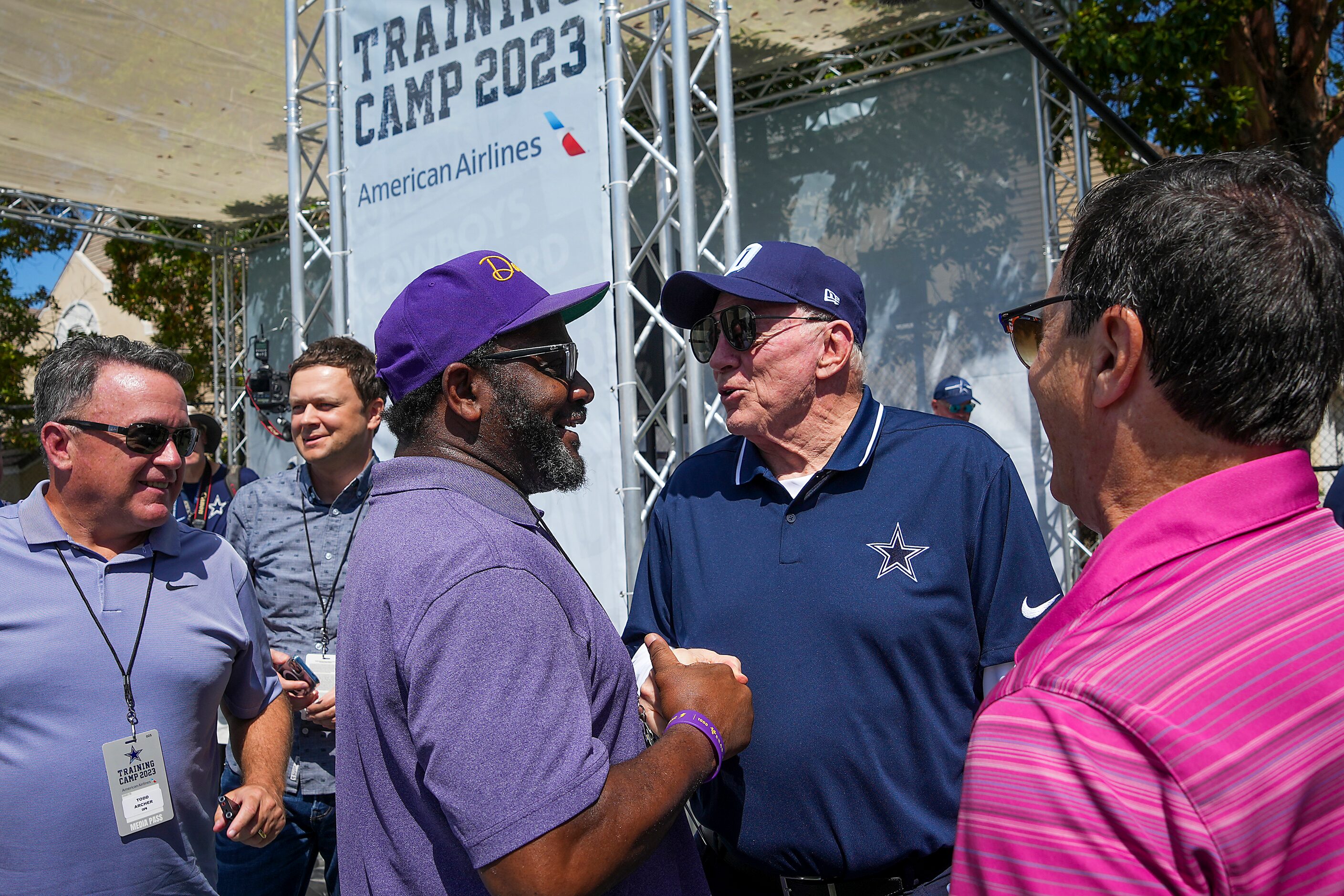 Dallas Cowboys owner and general manager Jerry Jones shakes hands with Clarence Hill of the...