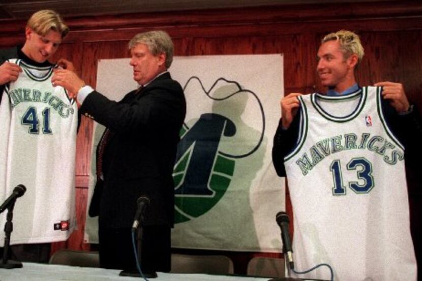 In this 1998 photo, Mavericks head coach Don Nelson (center) presents first-round draft...