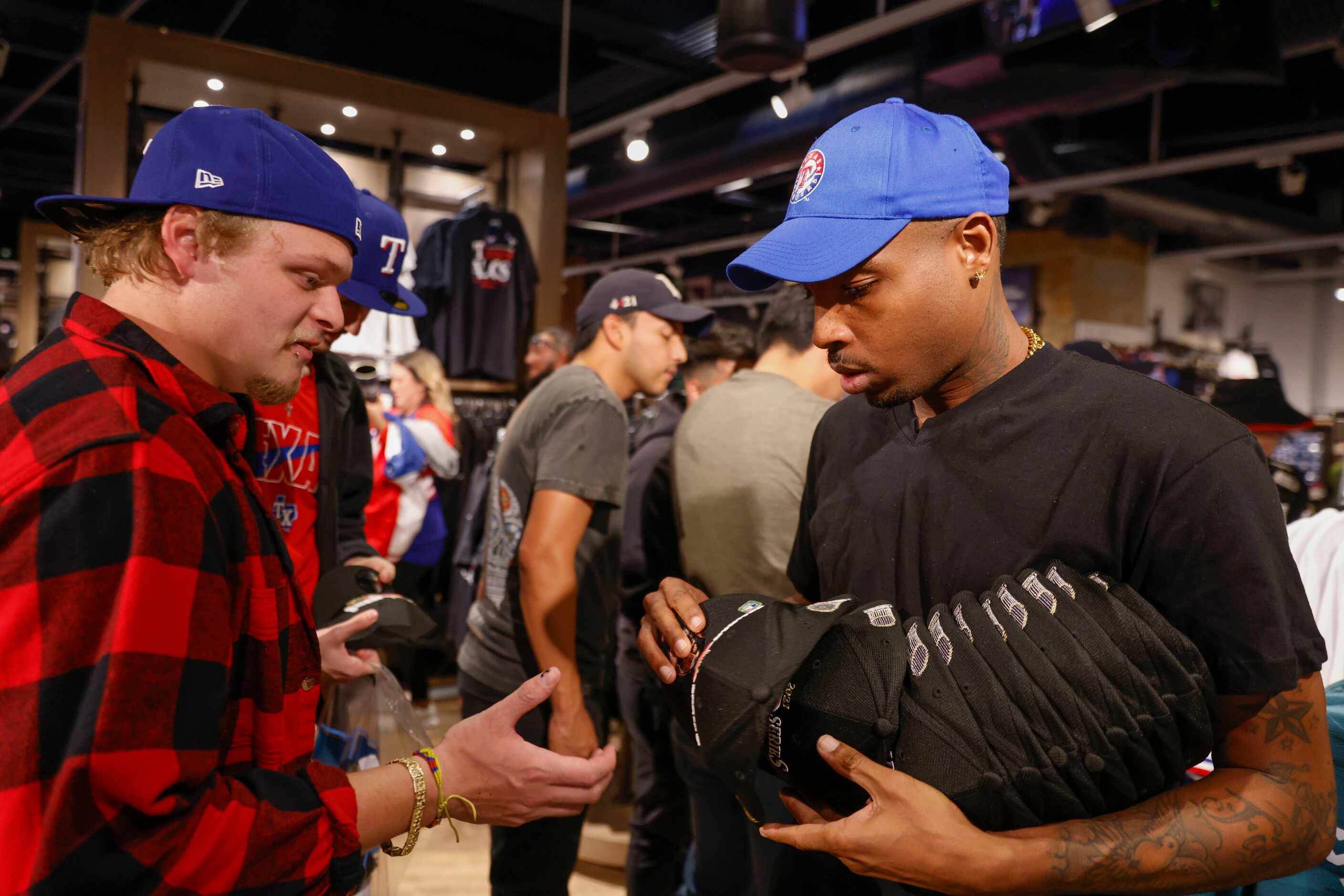 Texas Rangers fans go through the Grand Slam store following Texas Rangers’ winning the...