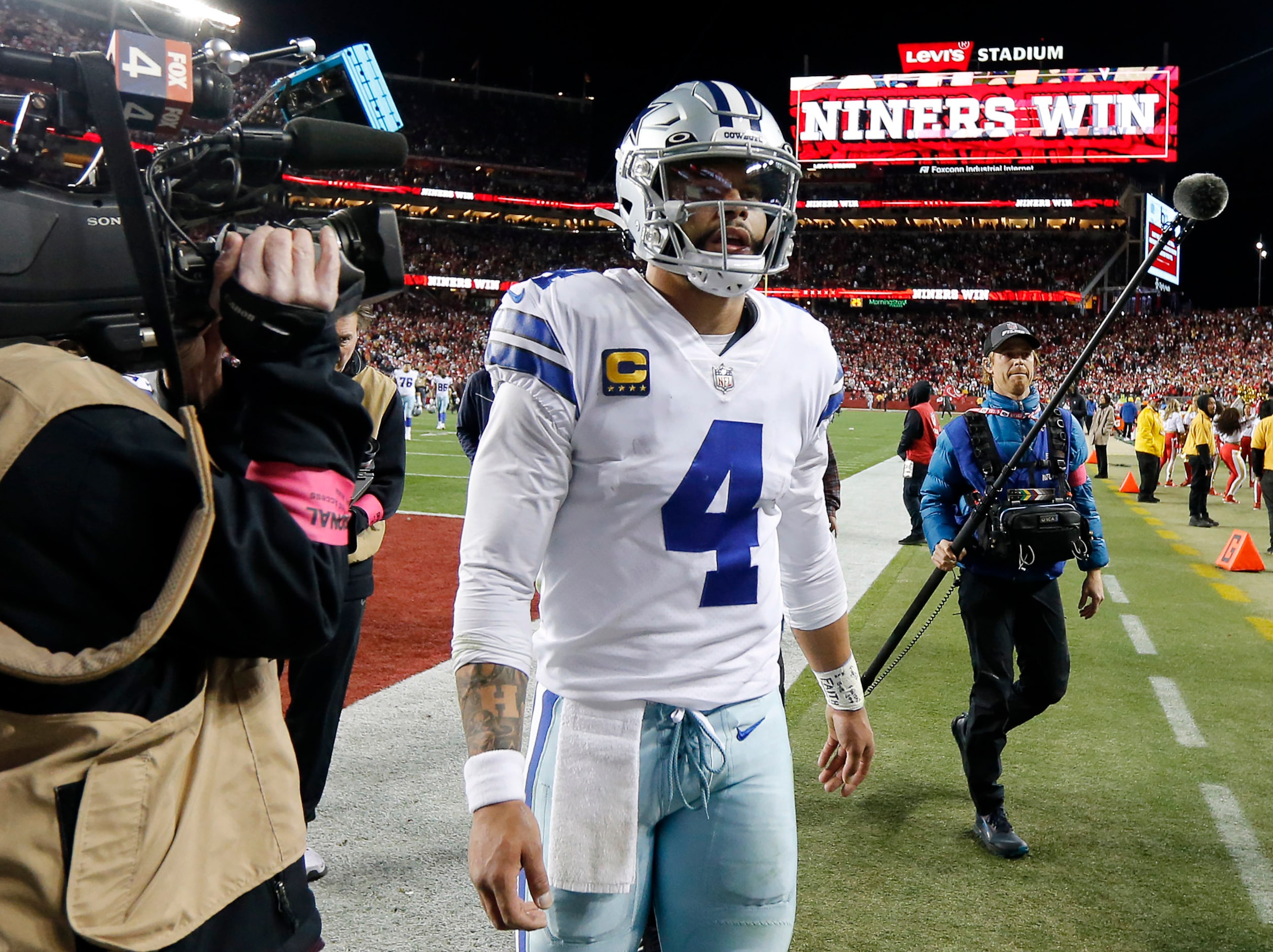 Dallas Cowboys quarterback Dak Prescott (4) walks off the field following their loss to the...