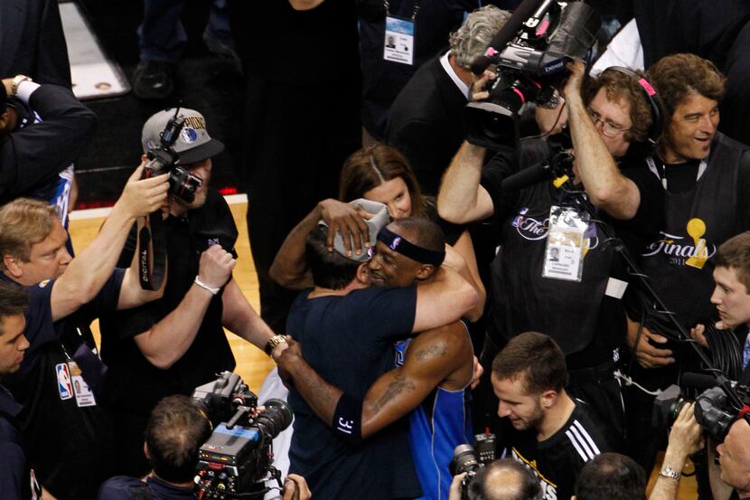 Dallas Mavericks shooting guard Jason Terry (31) hugs Mavericks owner Mark Cuban after the...