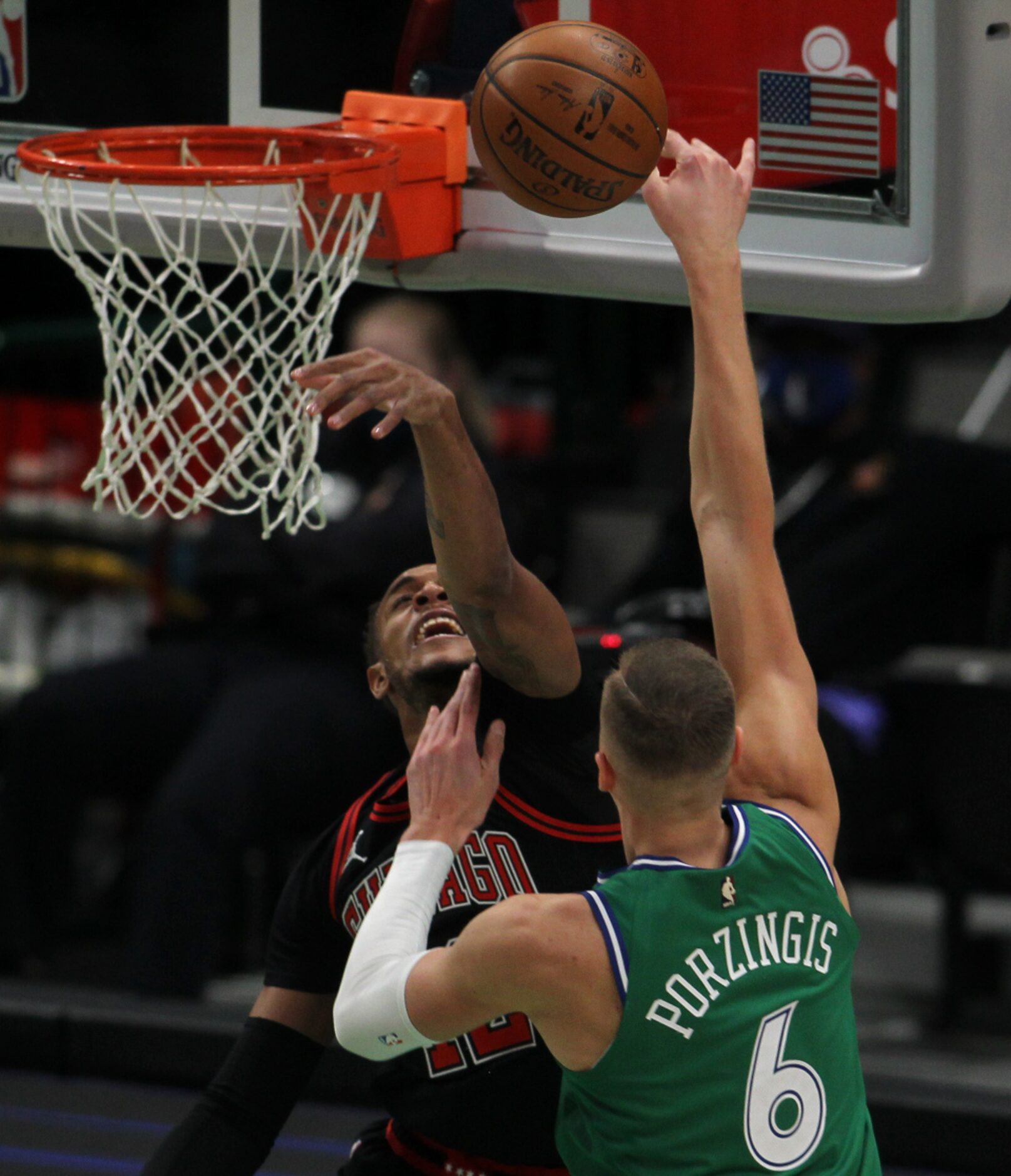 Dallas Mavericks center Kristaps Porzingis (6) has a shot knocked away by Chicago Bulls...