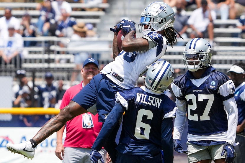 Dallas Cowboys wide receiver CeeDee Lamb (88) makes a catch over safety Donovan Wilson (6)...