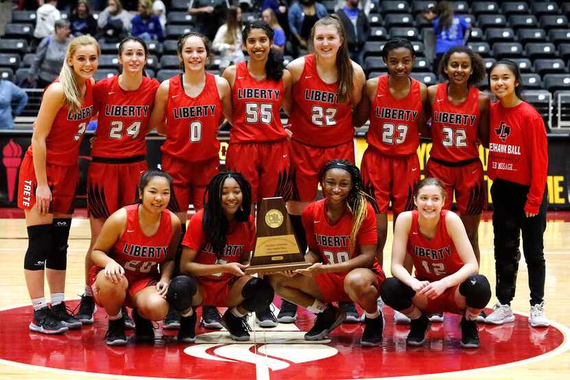 The Frisco Liberty High School basketball team receives their regional championship trophy...