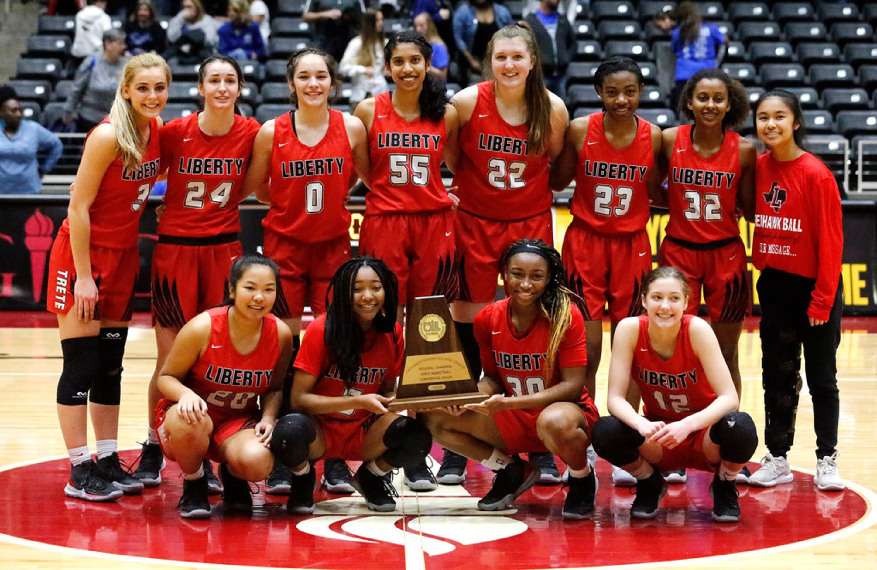 The Frisco Liberty High School basketball team receives their regional championship trophy...