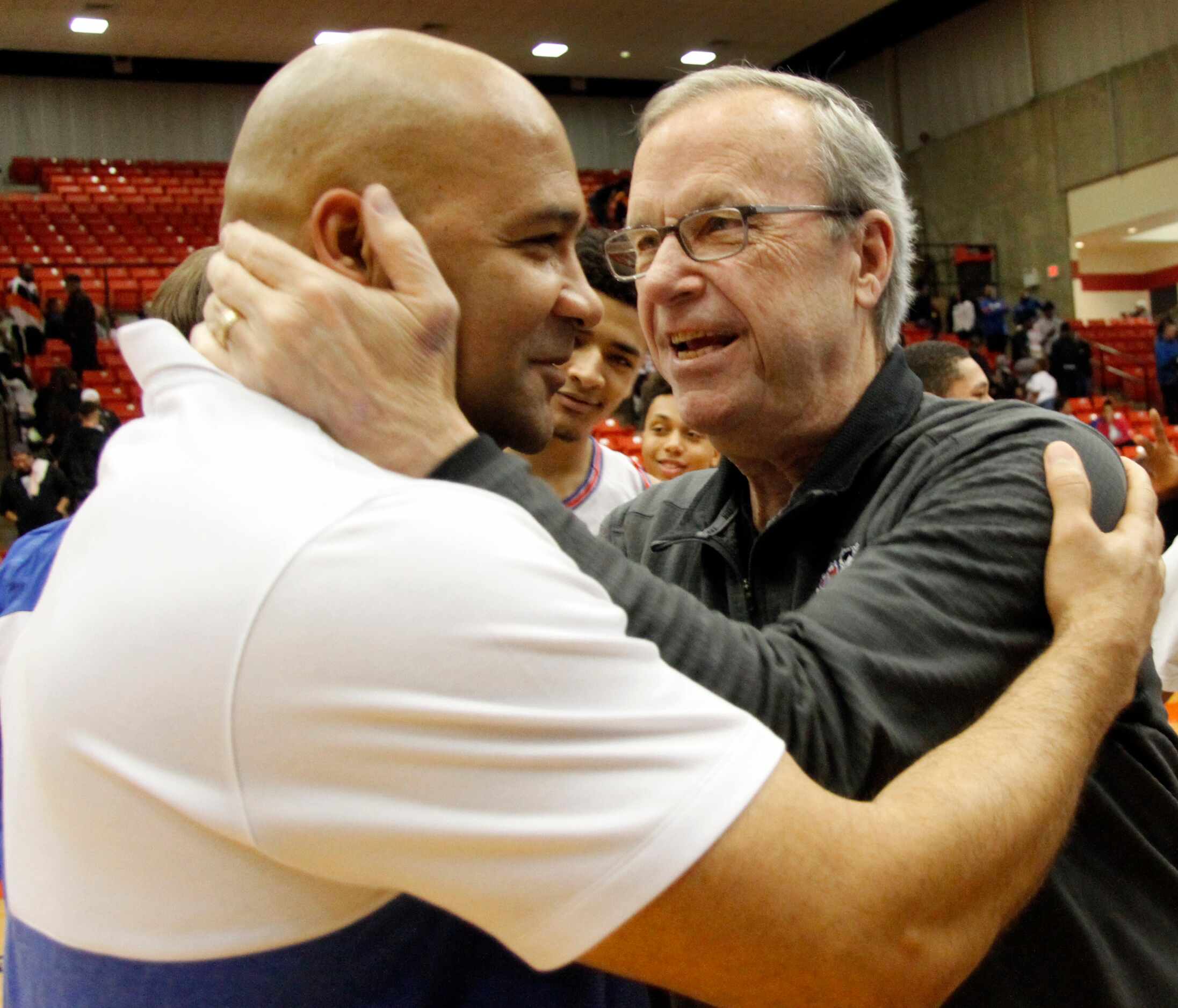 Former Duncanville boys head coach Phil McNeely, right, was quick to greet current head...