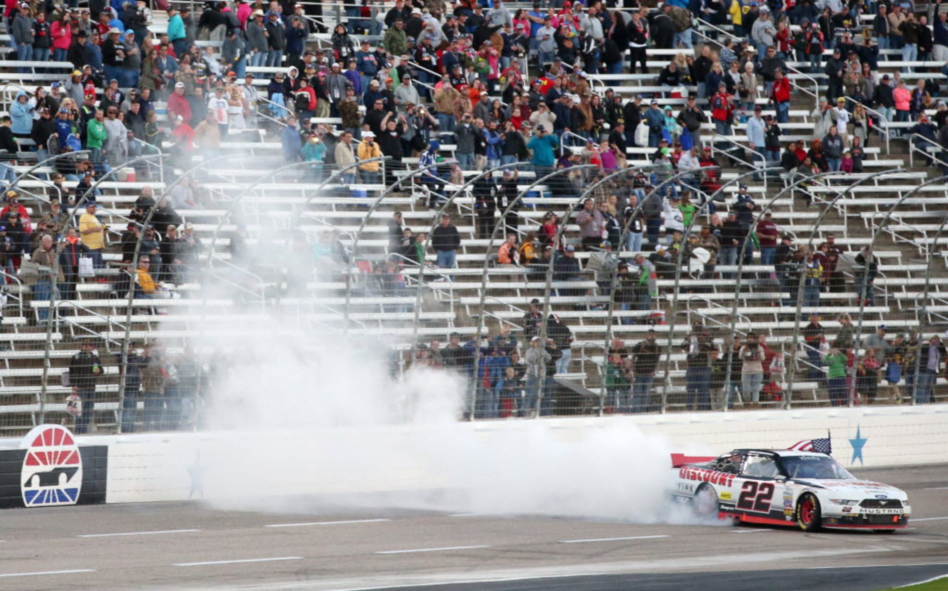 Brad Keselowski (22) celebrates after winning the NASCAR XFINITY SERIES 11th Annual O'Reilly...