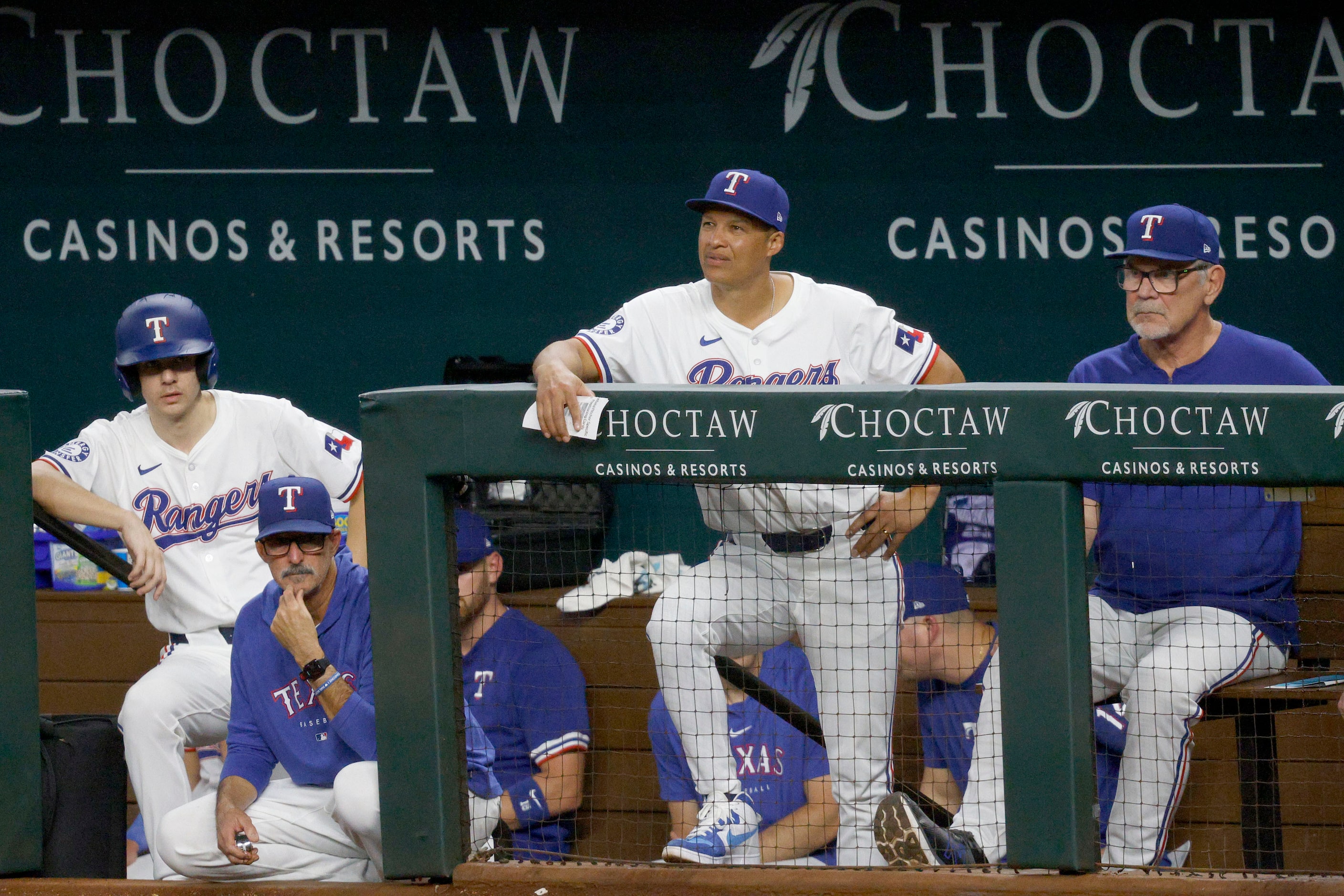 Texas Rangers manager Bruce Bochy (15), right, watches a game during the nineth inning of a...