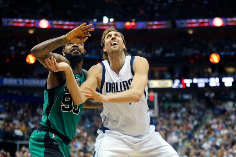 Dallas Mavericks forward Dirk Nowitzki (41) battles Boston Celtics forward Amir Johnson (90)...