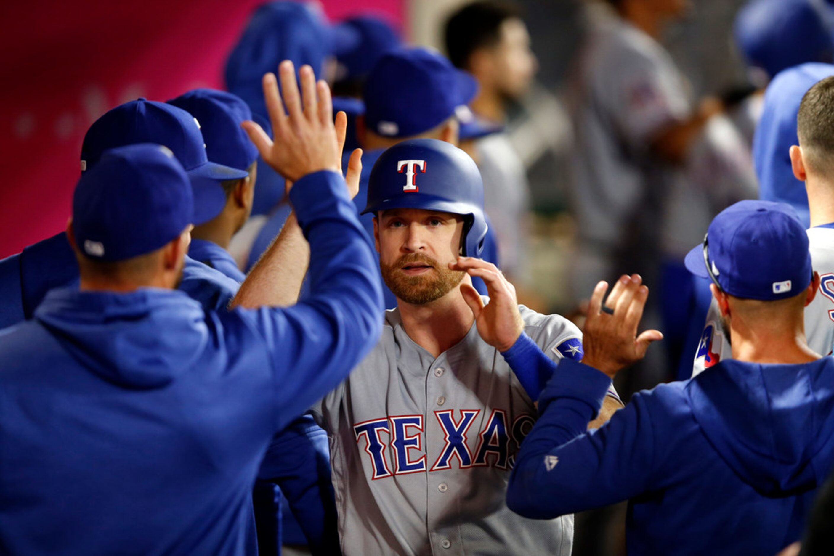 ANAHEIM, CALIFORNIA - MAY 24:  Logan Forsythe #41  is congratulated in the dugout after...