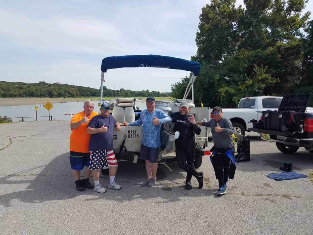 Jeff Burns and his team of volunteers. The volunteer divers believe three cars in the lake...