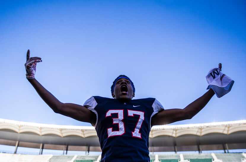 Allen defensive back Kendall Hayes (37) hypes up the fans during the second half of a Class...