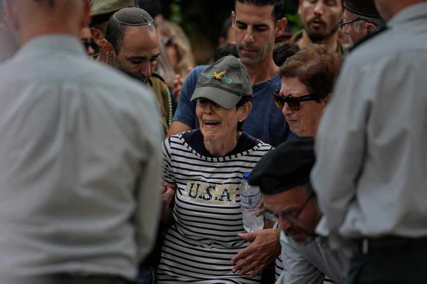 The mother of Israeli Col. Roi Levy cries during her son's funeral at the Mount Herzl...