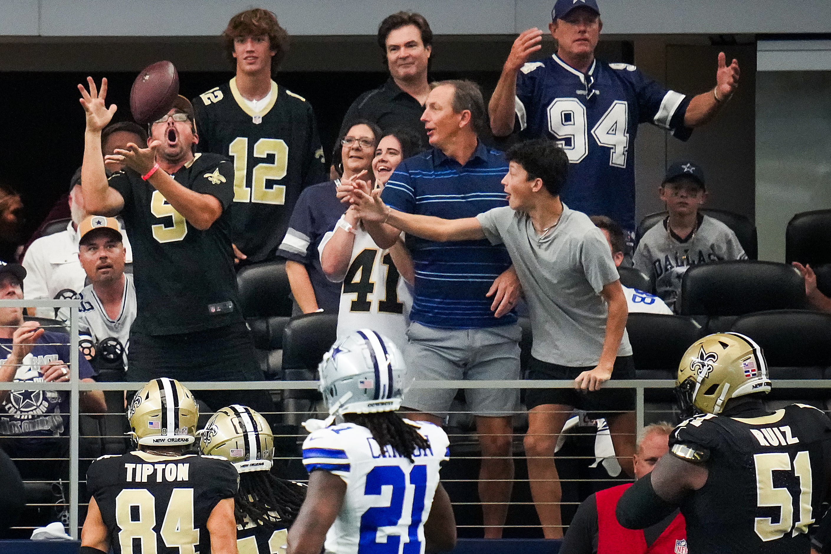 New Orleans Saints running back Alvin Kamara (41) tosses the ball to fans after scoring on a...