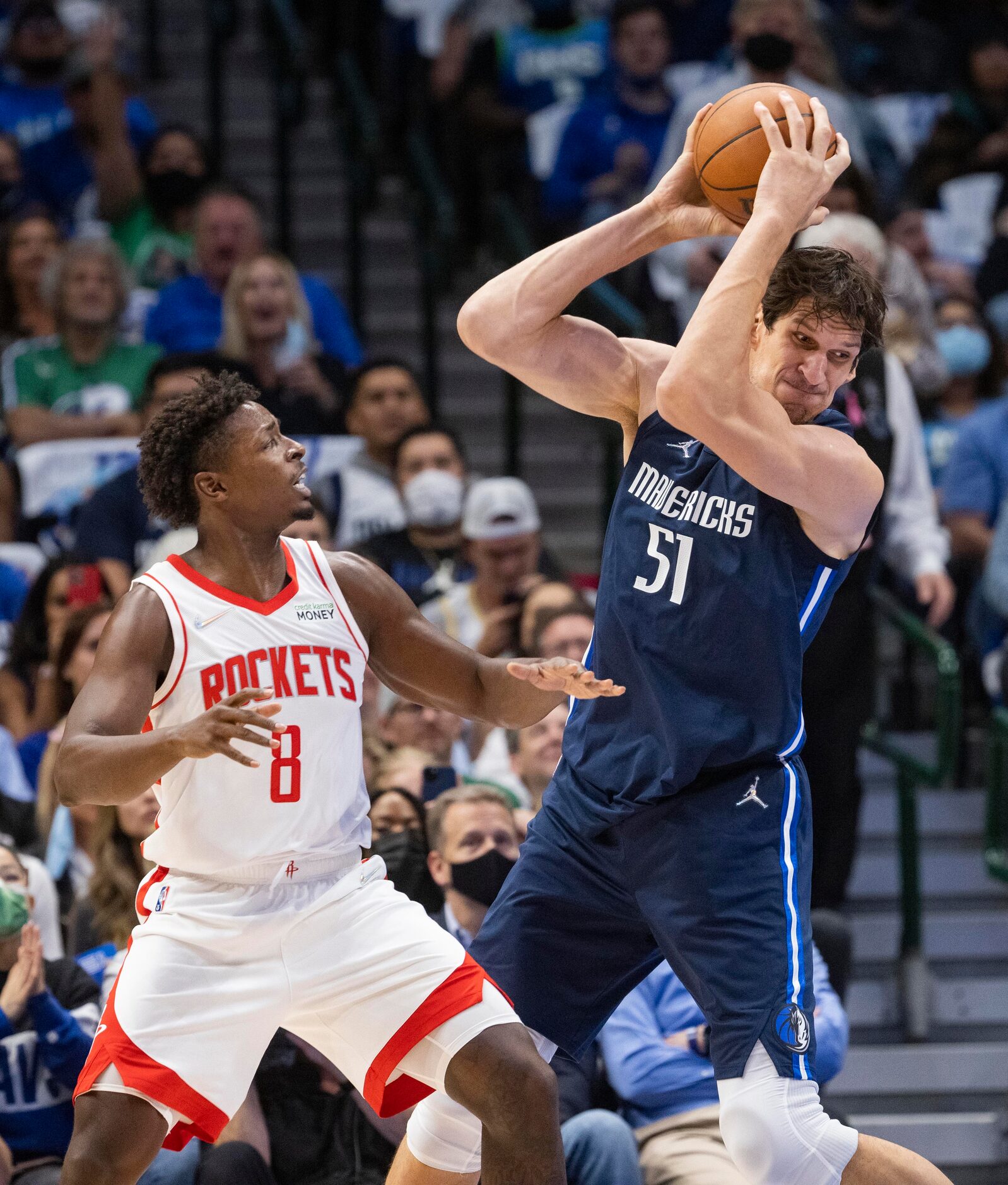 Dallas Mavericks center Boban Marjanovic (51) keeps the ball from Houston Rockets forward...