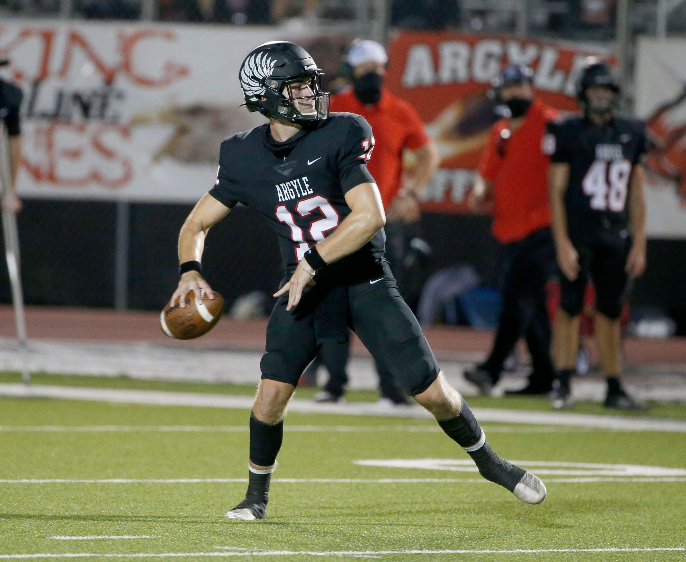 Argyle quarterback CJ Rogers (12) throws against Decatur during a high school football game...