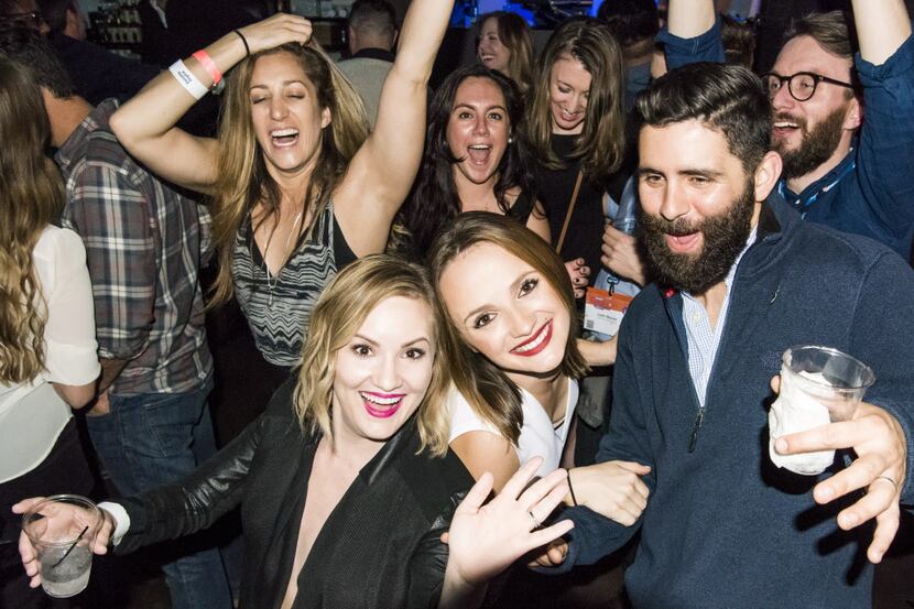 Partygoers attend a party hosted by Deloitte Digital during the South By Southwest (SXSW)...