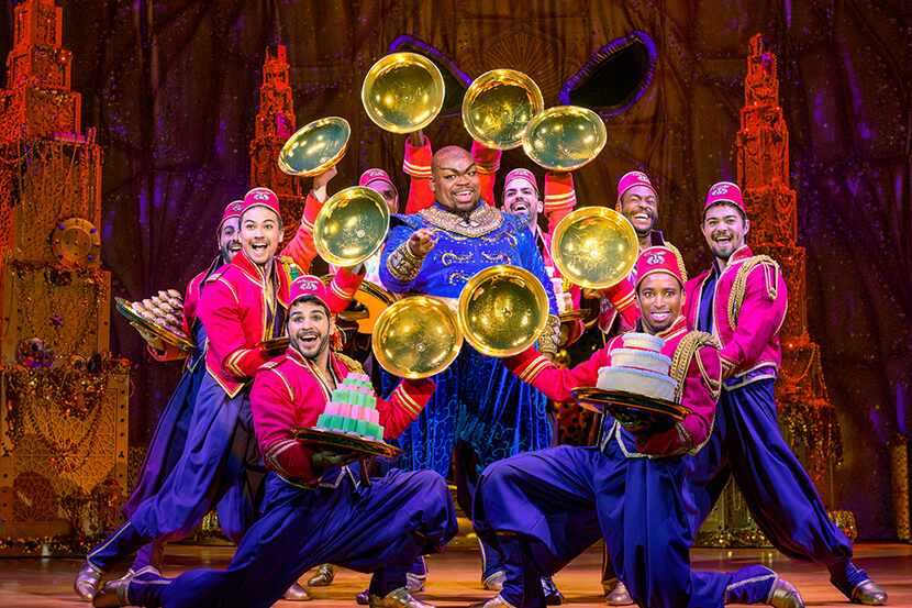 Marcus M. Martin, center, stars as the Genie in the touring production of "Aladdin."