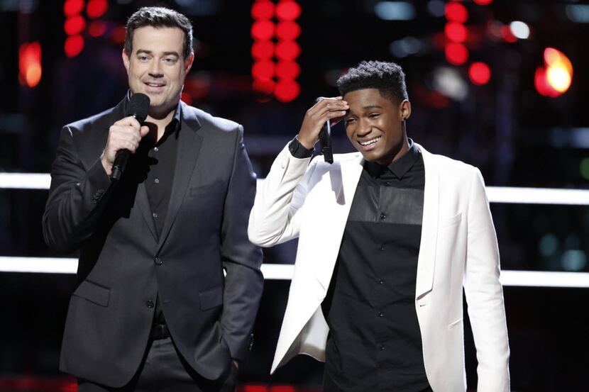 Host Carson Daly stands with Rowlett's Malik Heard after his performance during the battle...