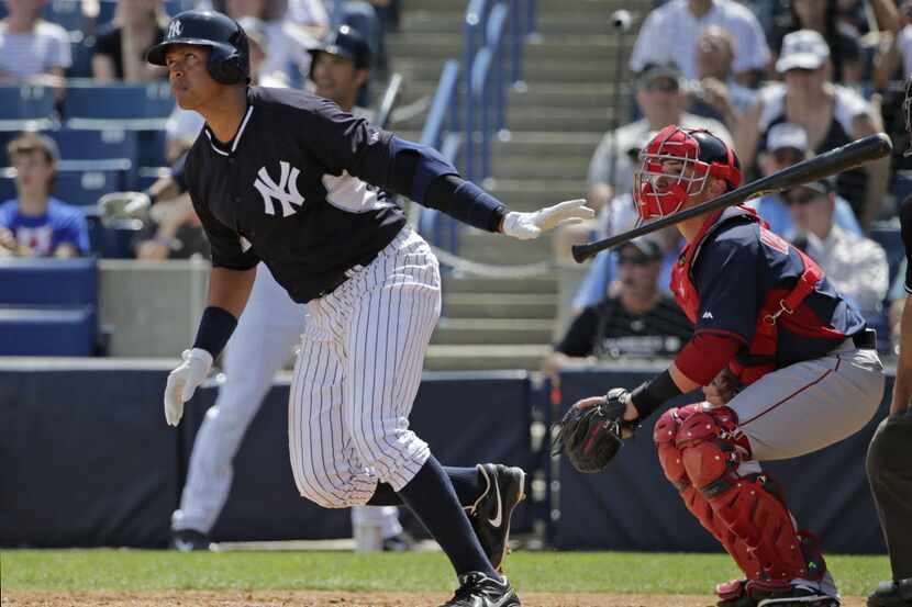 New York Yankees Alex Rodriguez tosses the bat as he watches his third-inning, solo home run...