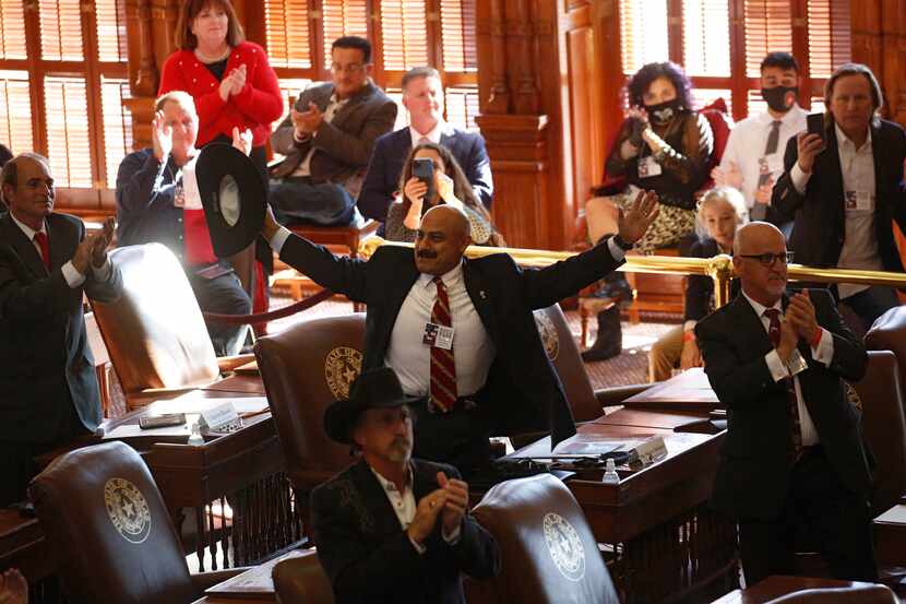 Maj. Marco A. Rodriguez (CD 23) and other Texas electors celebrate after the announcement of...