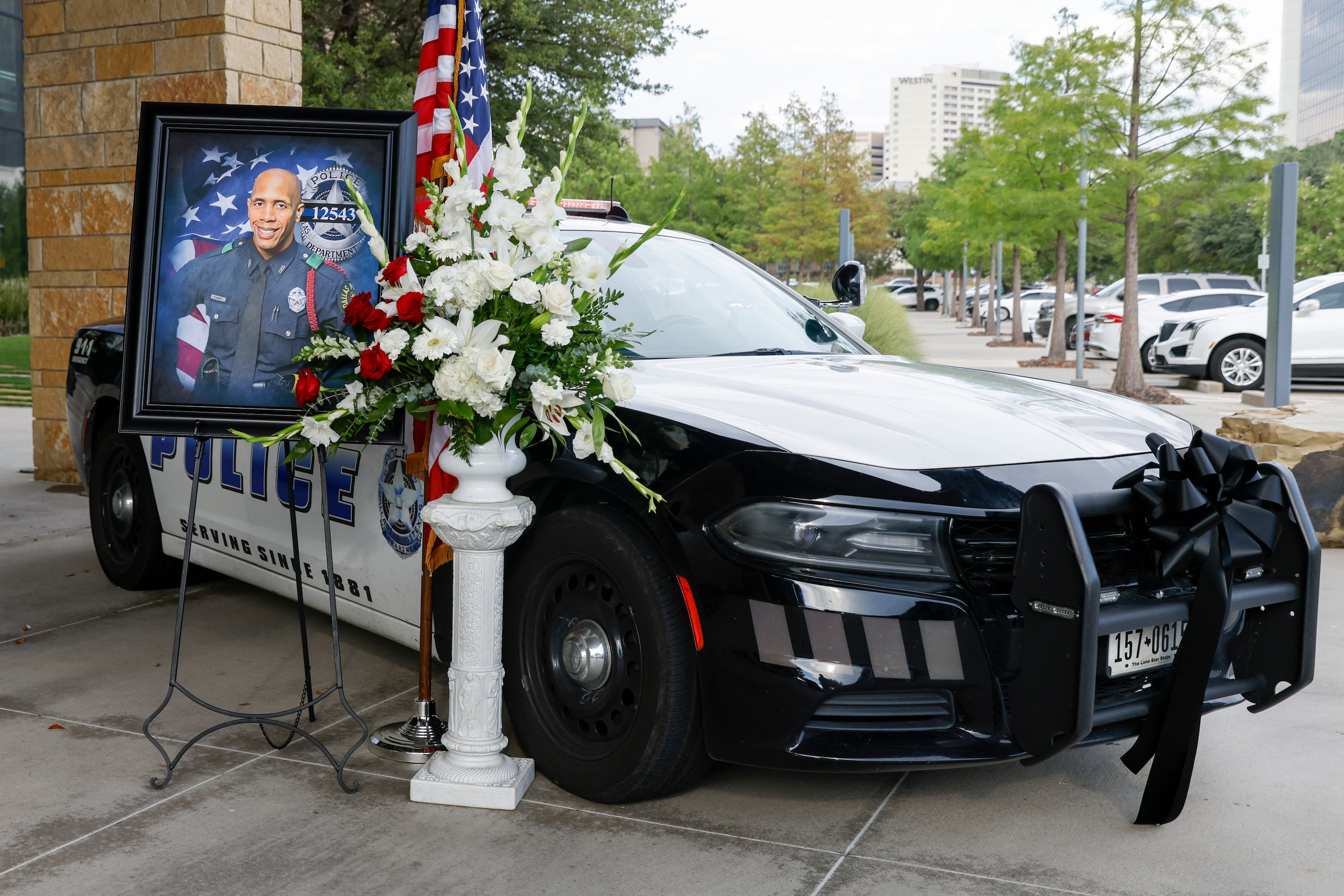 A memorial for Dallas police Officer Darron Burks is seen outside of Watermark Community...