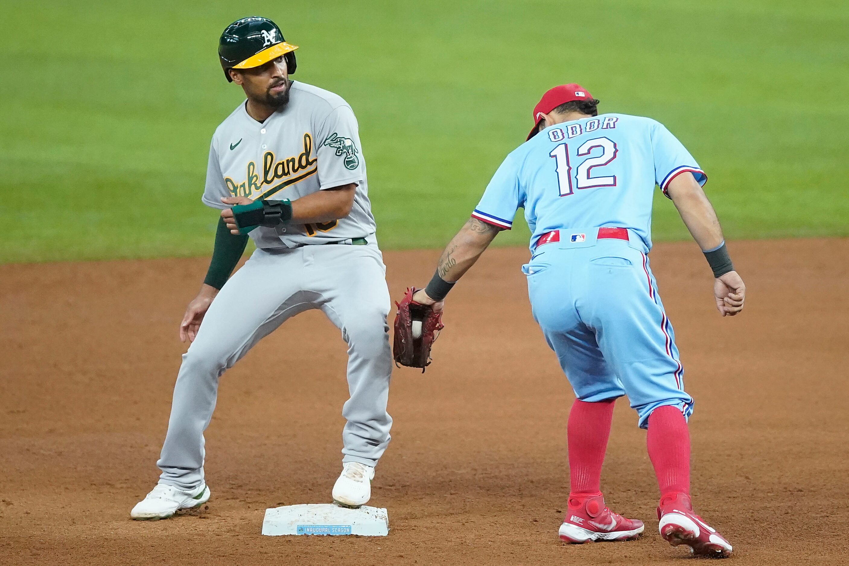 Oakland Athletics shortstop Marcus Semien is safe with a stolen base past Texas Rangers...