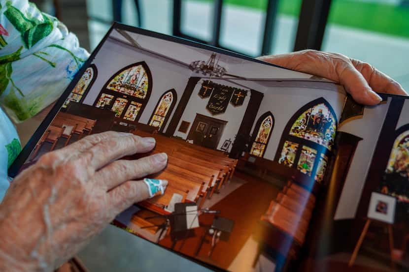 Virginia Anderson flips through a photobook during a service at Fellowship Church in Royse...