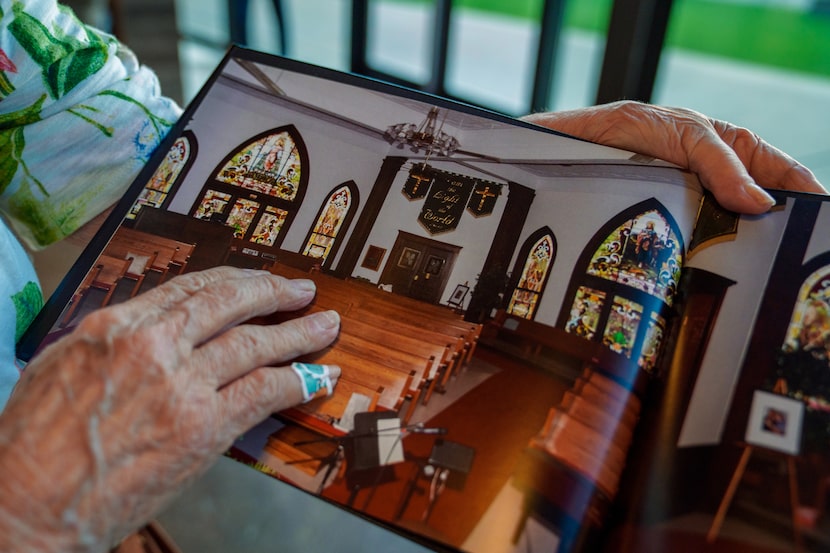 Virginia Anderson flips through a photobook during a service at Fellowship Church in Royse...