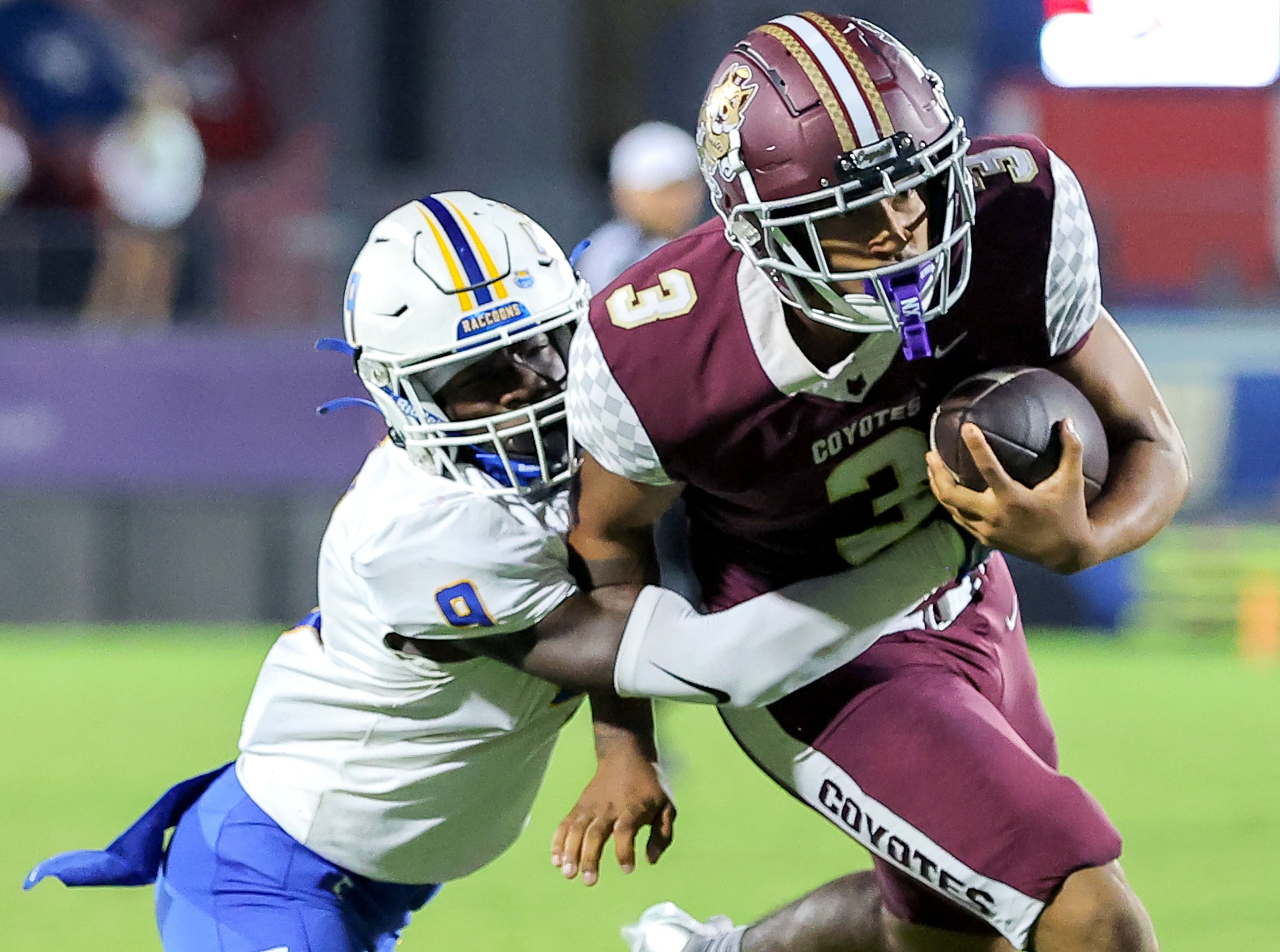 Frisco Heritage wide receiver Vincent Hooper (3) gets pulled down by Frisco defensive back...