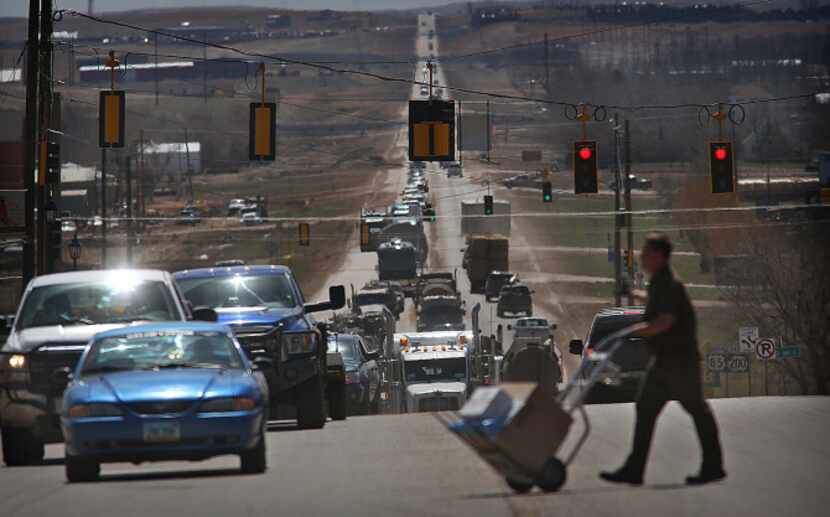 Traffic in Watford City, N.D., is heavy most of the day as trucks and other vehicles of all...