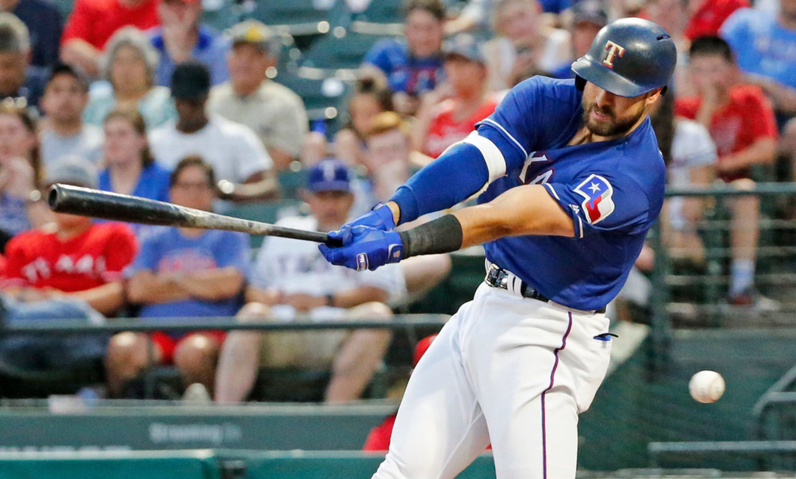 Texas Rangers left fielder Joey Gallo (13) swings and misses in the fourth inning during the...