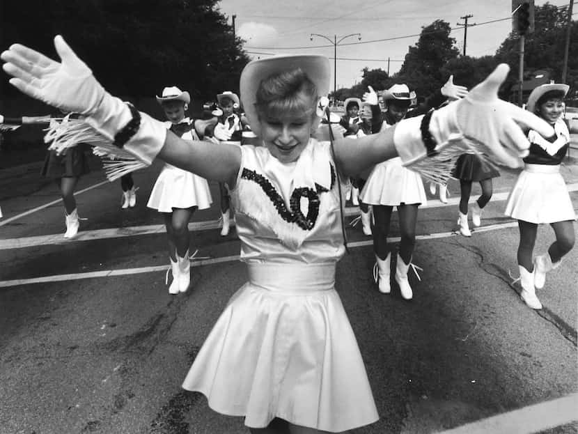 Carolyn Sellers led the Sunset High School drill team in a parade on West Jefferson...