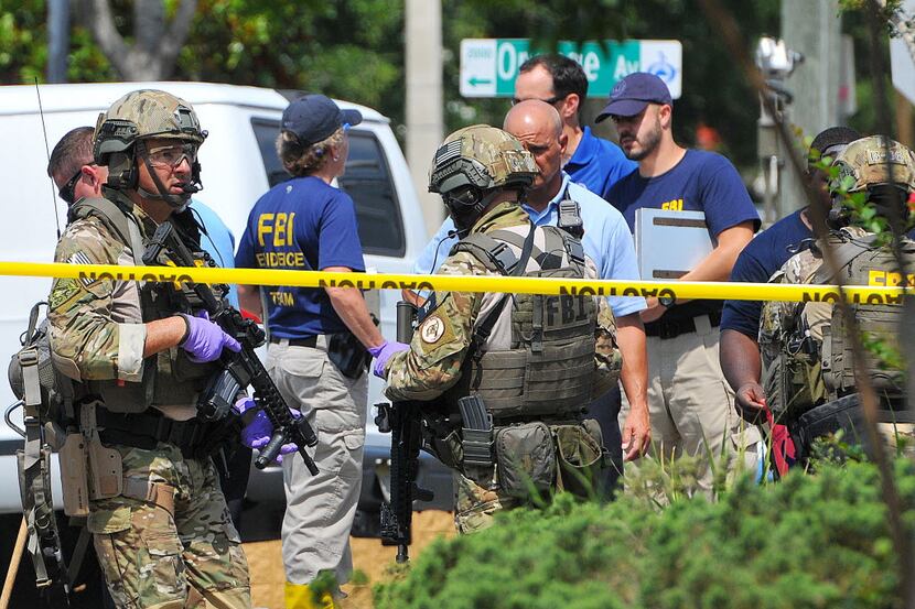  FBI, Orlando Police Department and the Orange County Sheriff's Office personnel investigate...