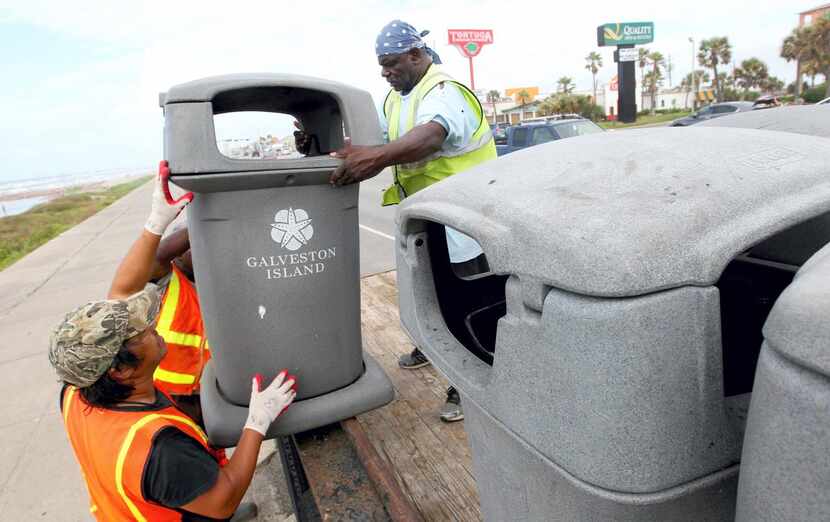 
Galveston Island Park crews removed trash barrels from the seawall Monday, preparing for...