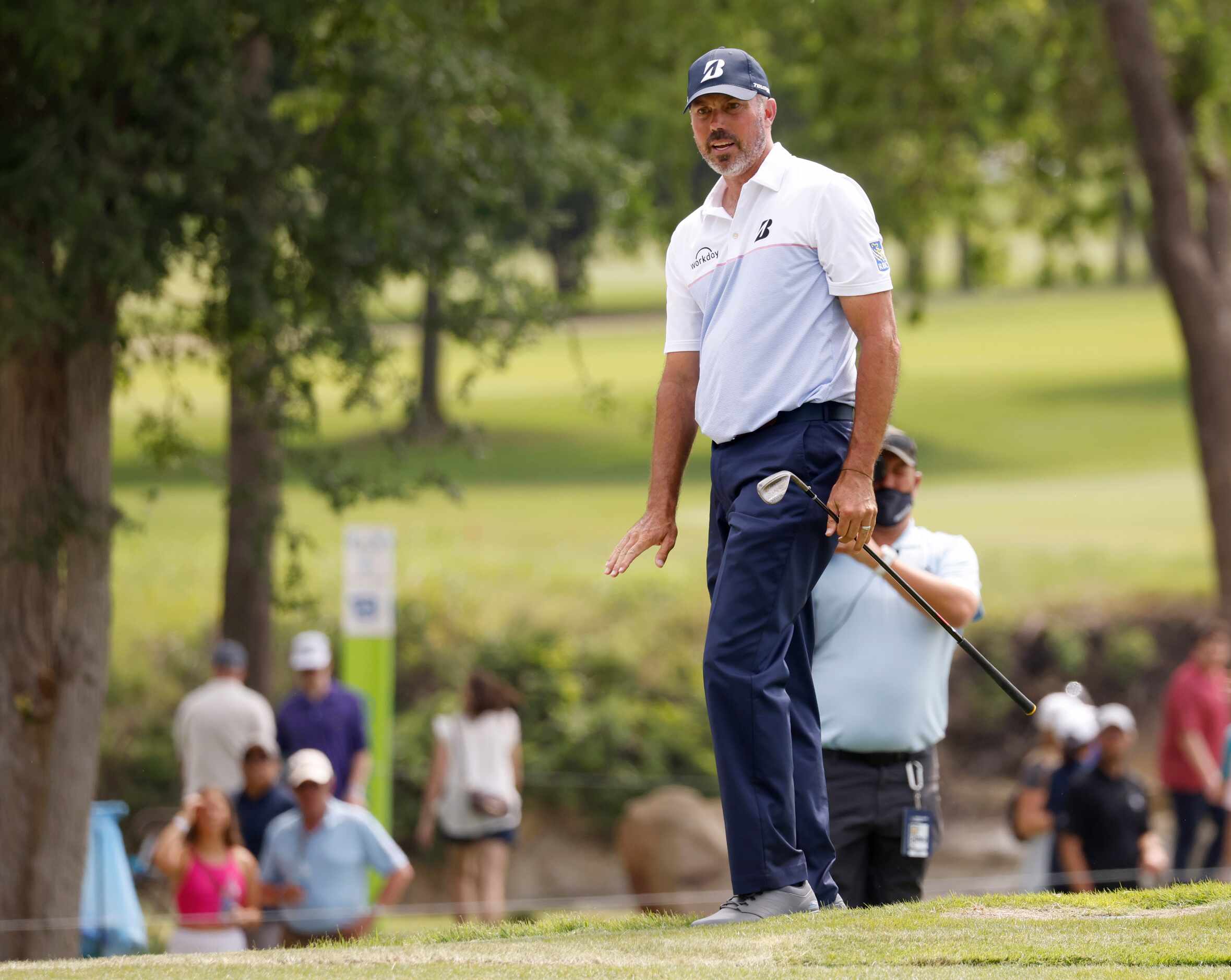 Matt Kuchar reacts as he watches his ball on the 14th hole during round 3 of the AT&T Byron...