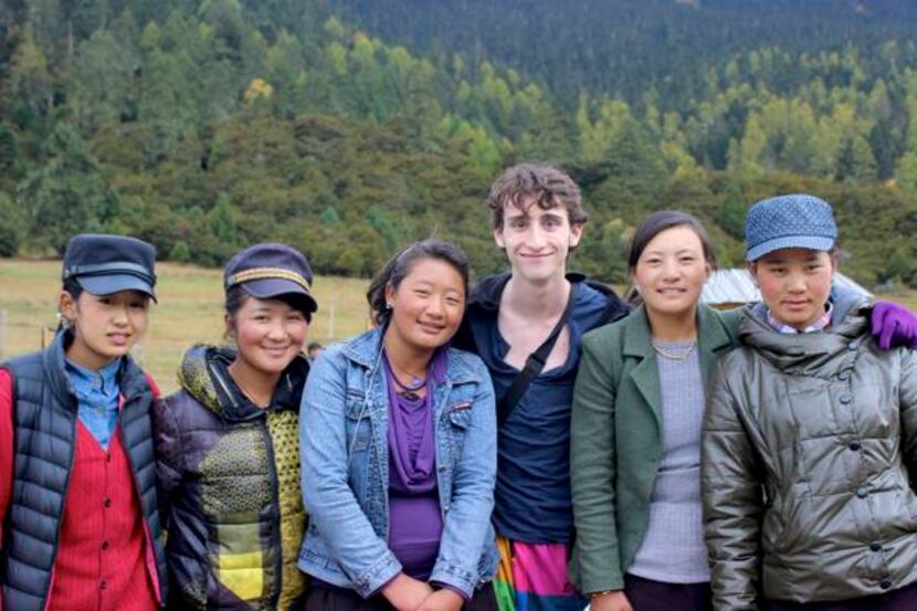 
Lake Highlands High School graduate Jake Gaba poses with Tibetan women after filming a...