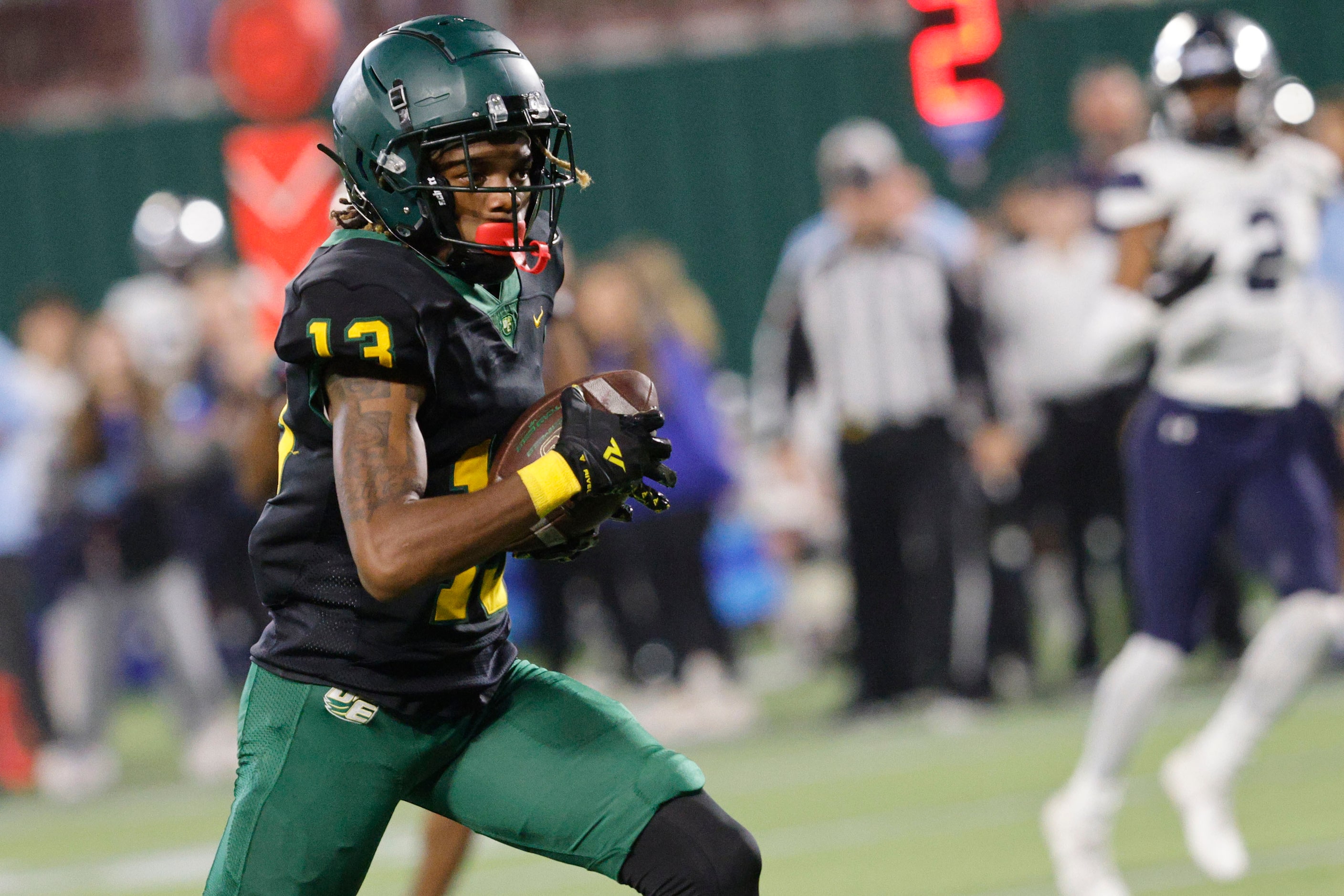 DeSoto's Daylon Singleton (13) runs into the end zone for a touchdown during the first half...