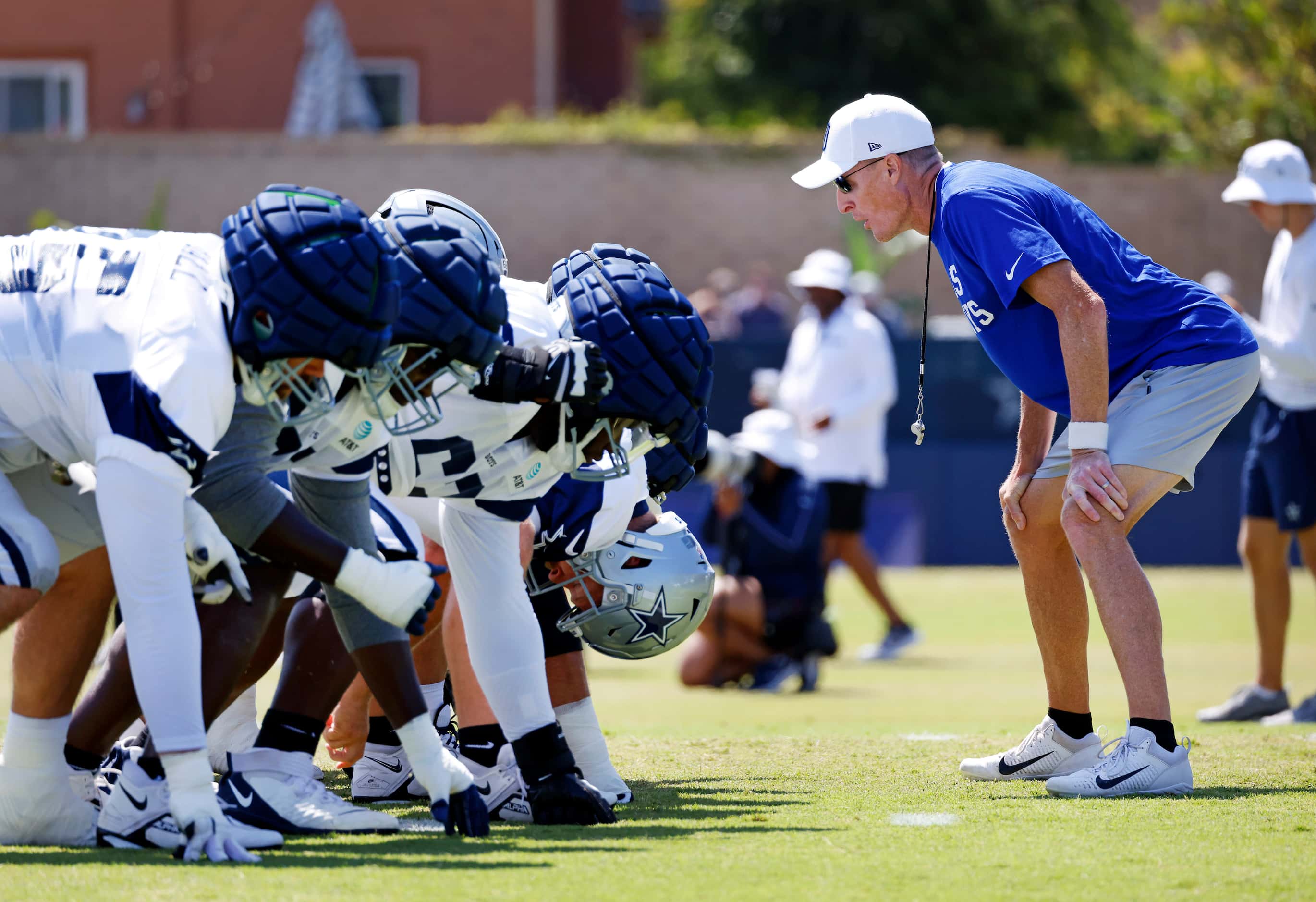 Dallas Cowboys special teams coach yells the count as lineman wait on the snap during a...